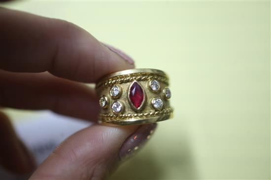A modern 18ct gold and collet set ruby and diamond dress ring, size P.